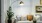 a white couch with a chandelier above it