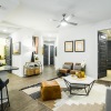 living room with view of kitchen and enterance