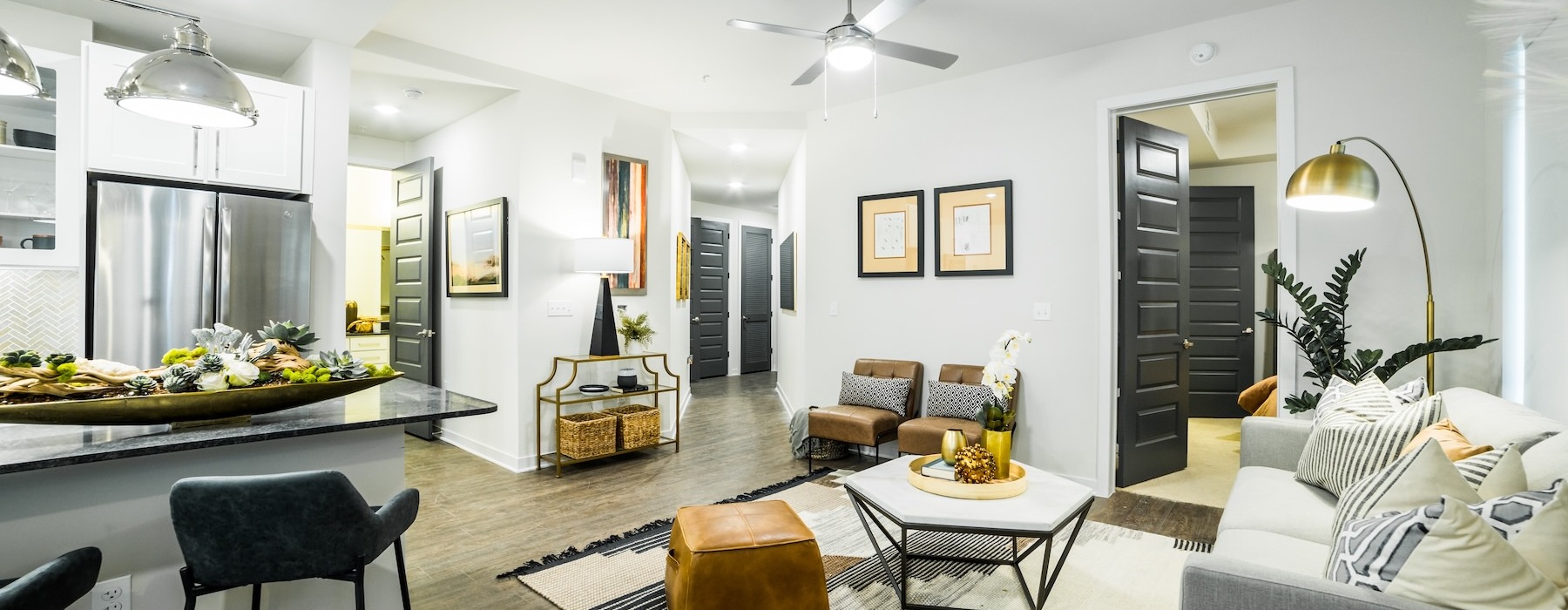 living room with view of kitchen and enterance