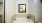 a bathroom with a picture on the wall