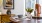 a dining table with a chair and a lamp