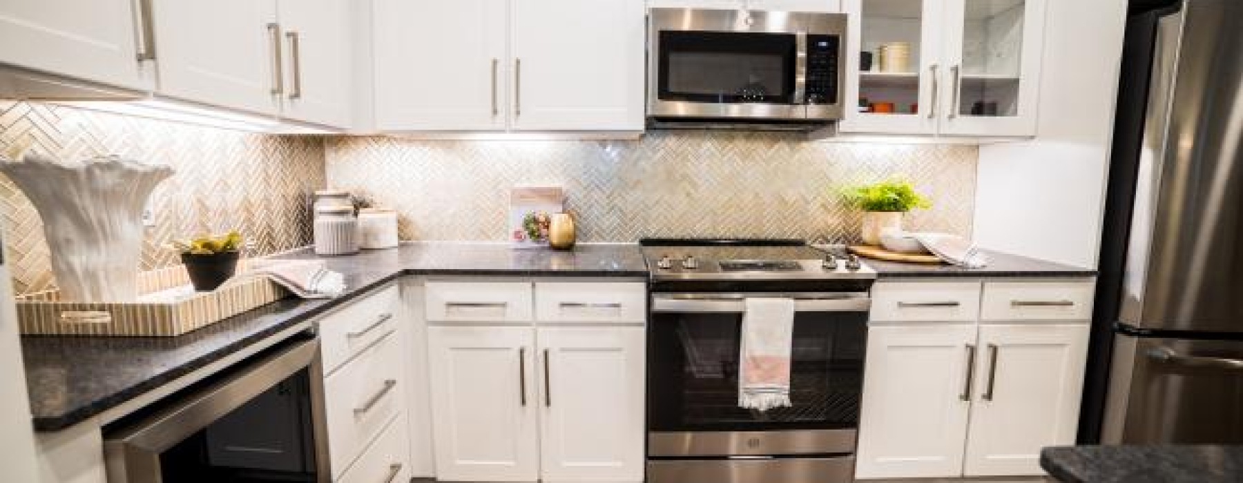 a kitchen with white cabinets