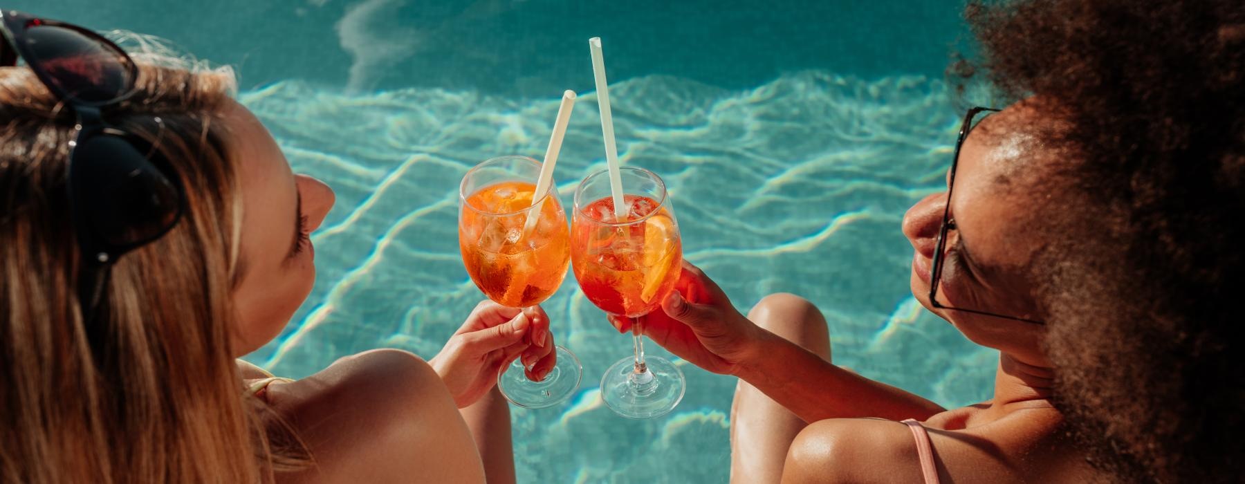 a man and woman drinking from glasses