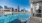 a pool with a city in the background