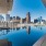 a pool of water with a city in the background